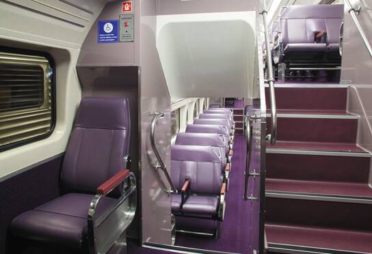 The interior of one of the newly refurbished country trains, in “bush plum”  tones.