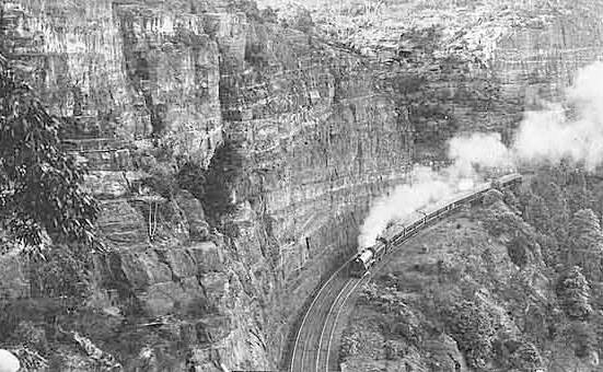A steam train chugs up the railway line cutting in Glenbrook in the early 1900s. Photos: State Records