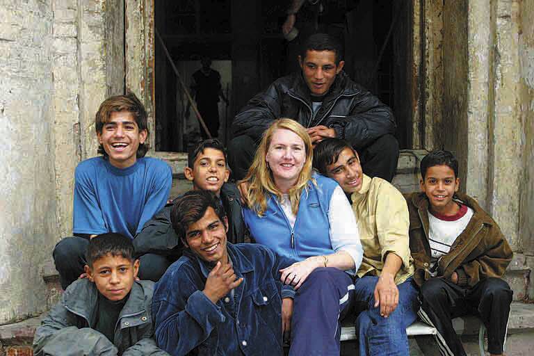 Donna Mulhearn with young people of Baghdad during her second trip to Iraq in November 2003.