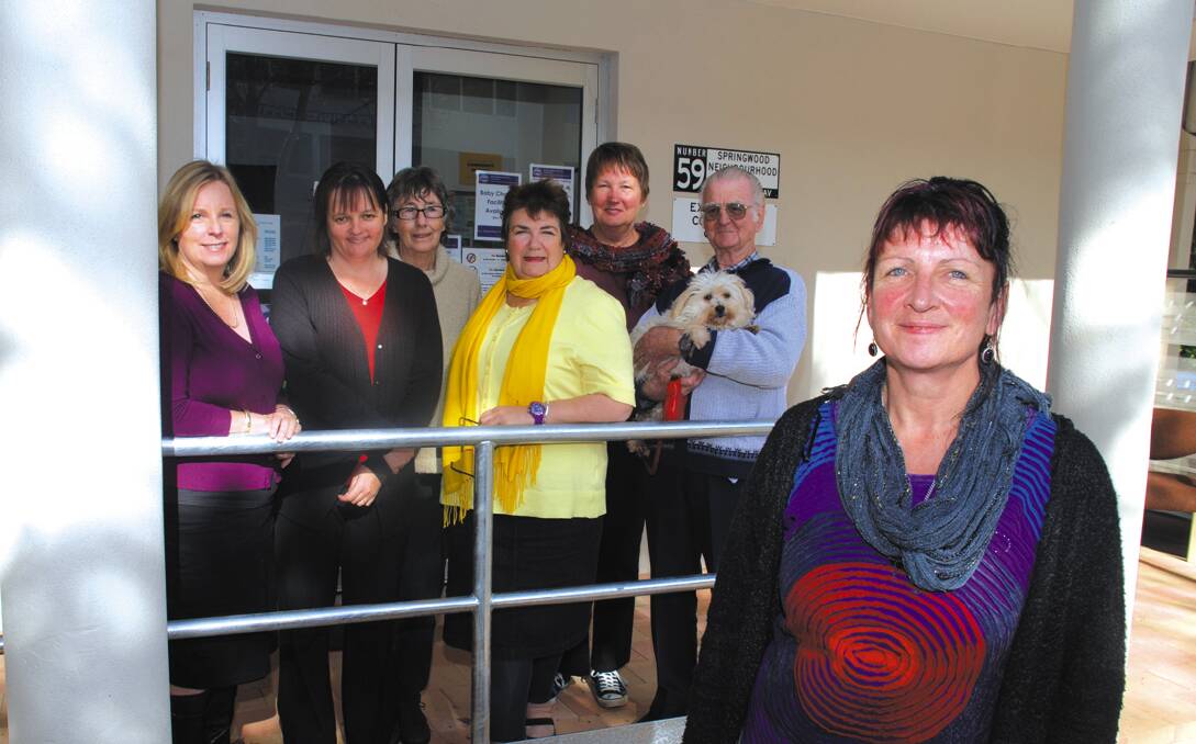 Springwood Neighbourhood Centre operations co-ordinator Ceila Lotus (front) with centre workers Kay Spriggs, Jo Newton, volunteer Ann Ludbrooke, worker Anne Snowdon, volunteer Alison Korbula and community member Ted Potter with Tiger outside the new premises in Springwood Avenue.