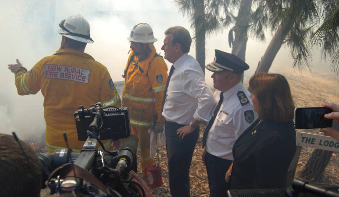 NSW Premier Barry O'Farrell inspects bushfire damage at Winmalee with NSW Rural Fire Service Commissioner Shane Fitzsimmons and Blue Mountains MP Roza Sage.