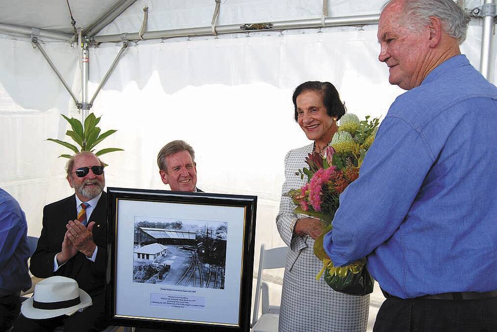 NSW Governor Marie Bashir accepts a gift from Ted Mullett of the Valley Heights Locomotive Heritage Museum on January 31, before unveiling a commemorative plaque.