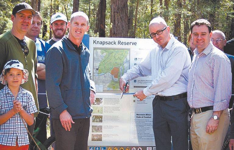 Deputy mayor Brendan Luchetti, mayor Mark Greenhill and Member for Penrith Stuart Ayers officially open the new Knapsack Reserve downhill mountain bike track with  mountain bike enthusiasts on September 21. 