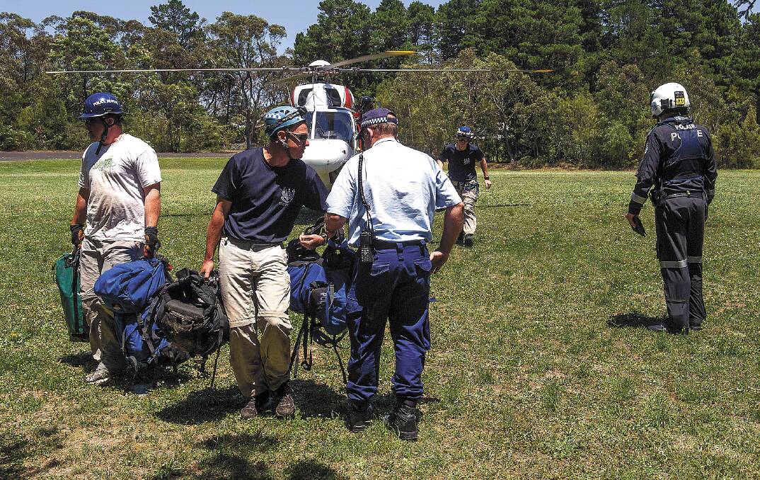 Police rescuers at Murray Park in Wentworth Falls on Monday afternoon after a rescue mission to recover the body of a British tourist who fell at the  waterfall at Wentworth Falls a day earlier. Photo: Gary Moloney, Weatherboard Photography.