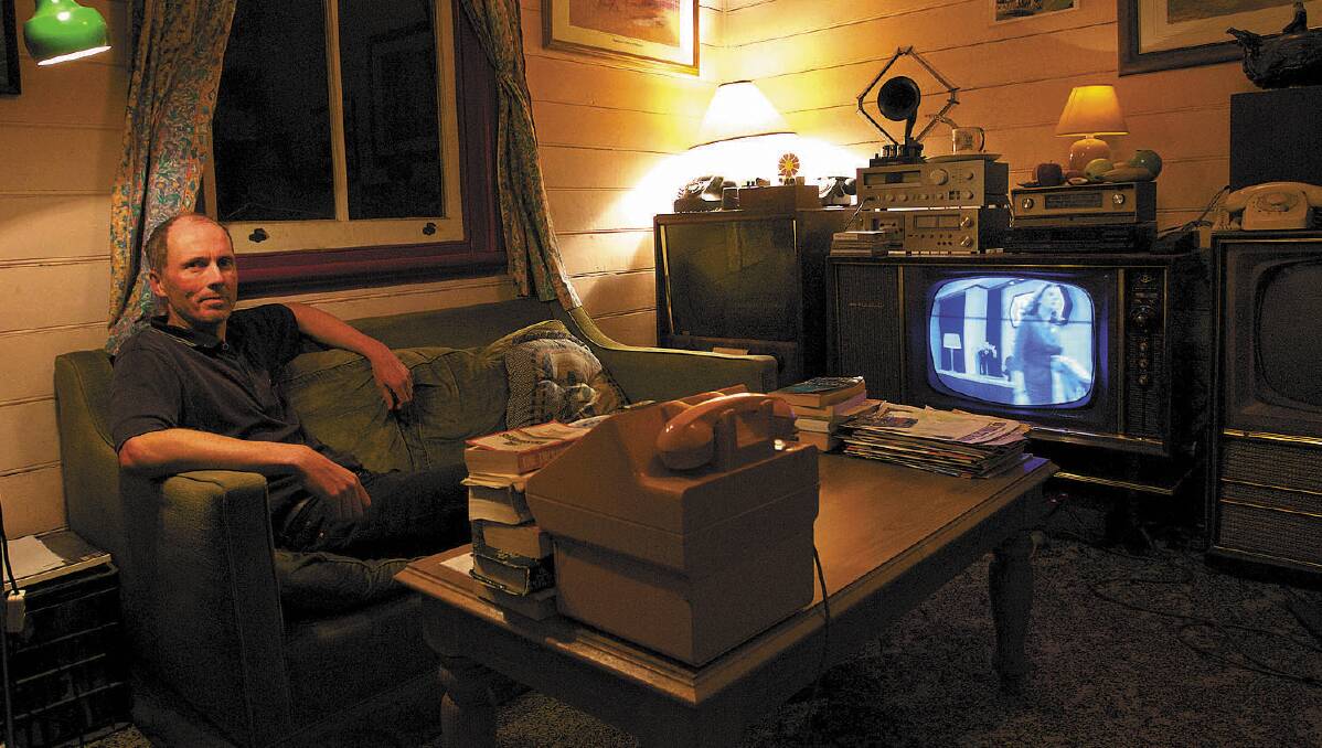 Electronics technician and TV collector John Hunter witnesses the end of the analog era of viewing at his Hazelbrook home. Photo: Wolter Peeters.
