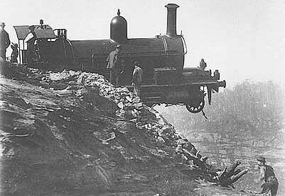 A photograph from State Records of a steam locomotive that derailed on the 'Big' Zig Zag section of track above Ida Falls Gully near Lithgow on April 4, 1901.