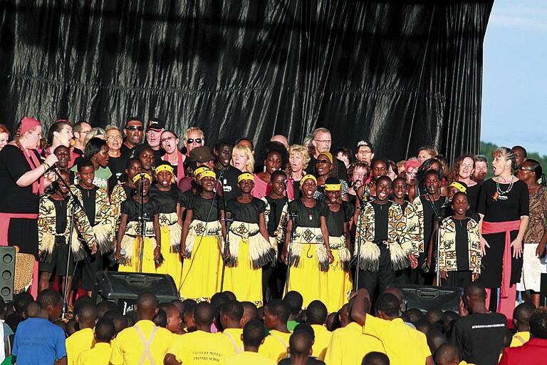 Singers from Kwaya Australia perform with the African Children's Choir, which will tour the Blue Mountains in August.