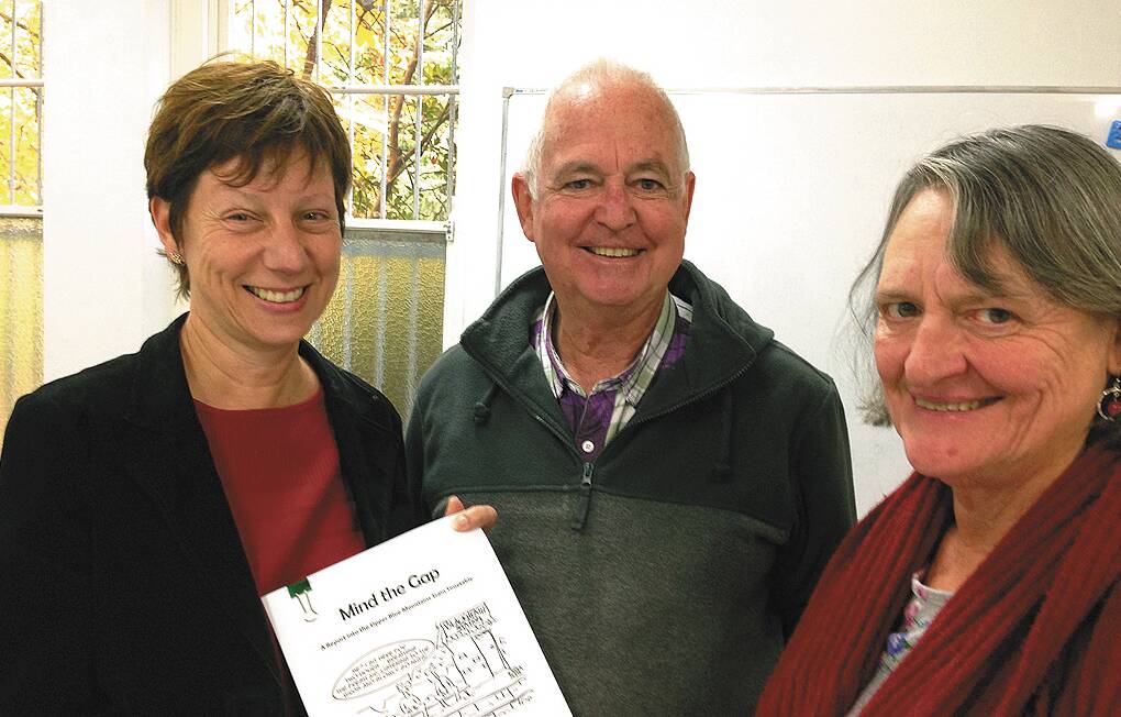 From left, Cornelia Gartner, Murray Bailey and Heather Pye read the research on Blue Mountains train services indicating the community wants an hourly train service west of Katoomba.