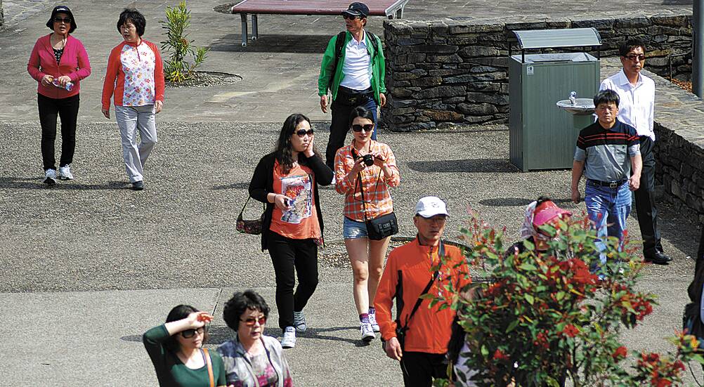 Asian tourists visiting Echo Point in Katoomba last year. Council is considering establishing a Sister City relationship with a Chinese city or district.