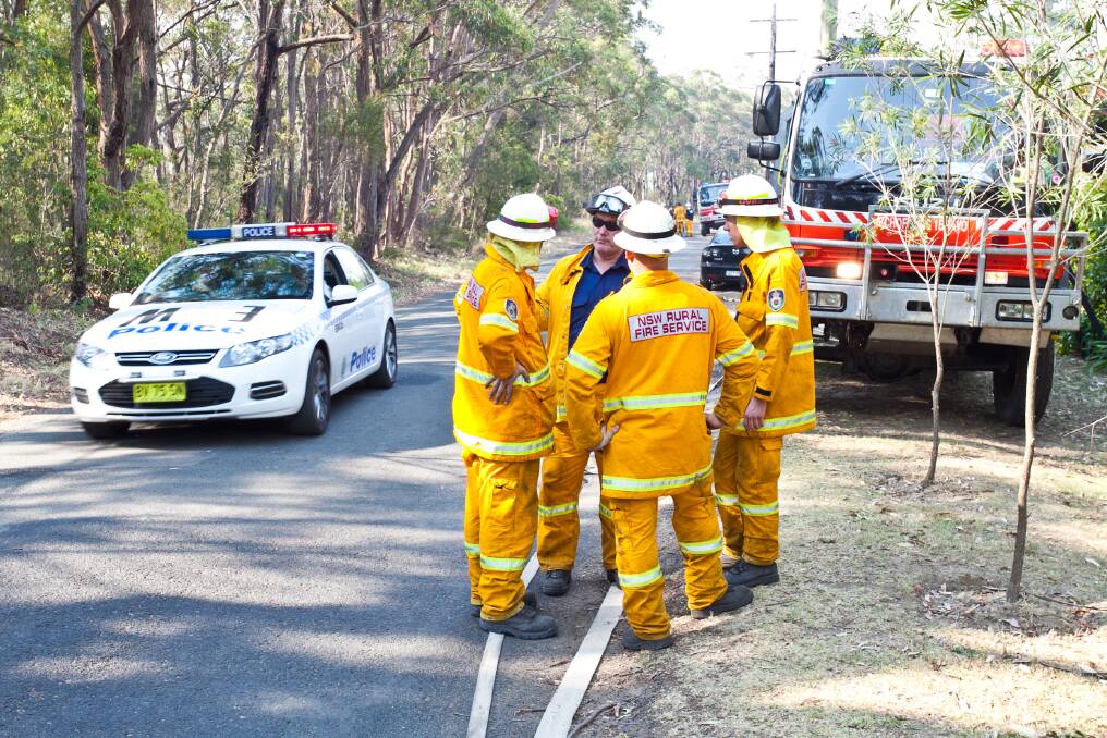 Fire and rescue services prepare for bushfires as they approach the suburb of Faulconbridge, 21 October 2013.PHOTO: GEOFF JONES .