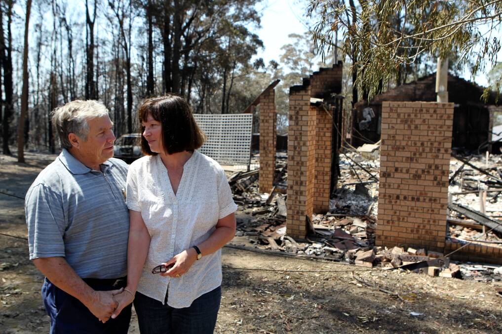 Brian and Maree Simpson in front of their house destroyed by bushfire in Yellow Rock in the Blue Mountains. 19th October 2013 Photo: Janie Barrett