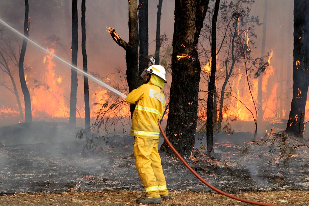 Firefighters tackle a bushfire at Winmalee in the Blue Mountains, NSW. 19th October 2013 Photo by Janie Barrett