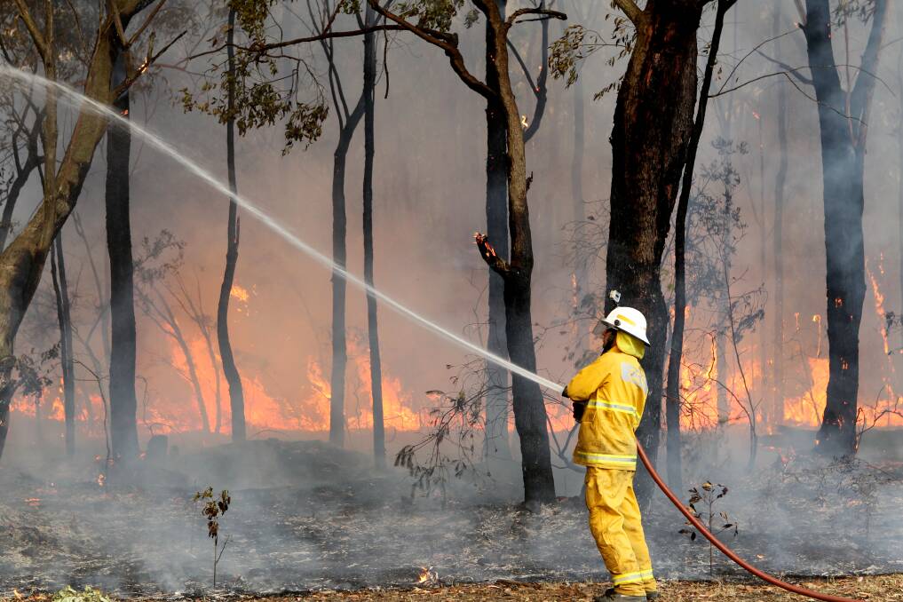Firefighters tackle a bushfire in Winmalee in the Blue Mountains, NSW. 19th October 2013 Photo: Janie Barrett