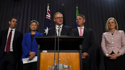 Labor secures support for a working minority government, but hopeful of more