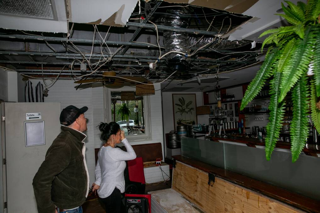 EXTENSIVE DAMAGE: Matt and Carolina Starling, owners of Moonlight Social Club, examine the damage to their ceiling following a fire in an adjoining restaurant. Photo: Geoff Jones