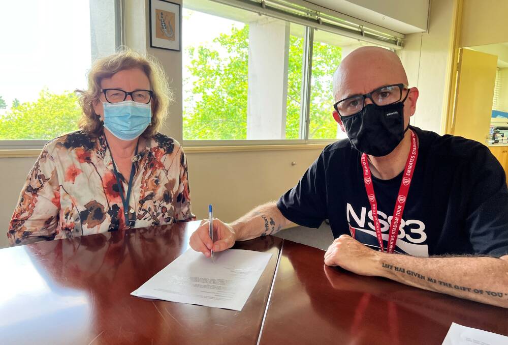 Staying afloat: Cr Mark Greenhill and CEO Dr Rosemary Dillon sign, under joint delegation, a new memorandum to implement further support for local businesses.