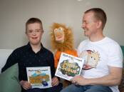 Elijah Lonsdale (left) with his father and puppeteer for Crumpet, Rob Lonsdale. Picture by Tom Lonsdale