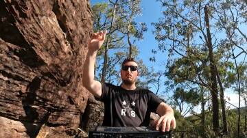 Julian Treweeke, artist name Dysphemic, making beats in the Blue Mountains bush. Picture supplied