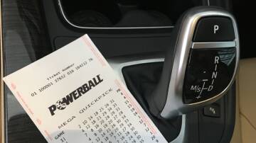 A Powerball ticket on a car's centre console. Picture supplied
