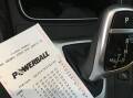 A Powerball ticket on a car's centre console. Picture supplied