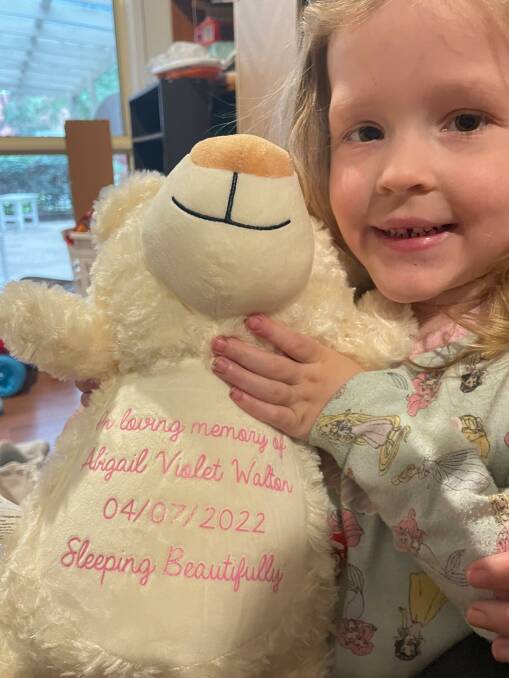 4-year-old Charlotte Walton was looking forward to becoming a big sister, she holds a memorial angel bear recognising her younger sister Abigail's death in 2022. Picture supplied by Jodie Roberts