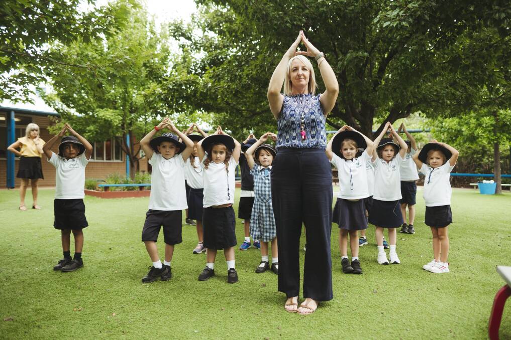 Jerrabomberra Public School teacher Megan Drury with year 1 students practising movement meditation as part of the Smiling Mind program. Picture: Dion Georgopoulos