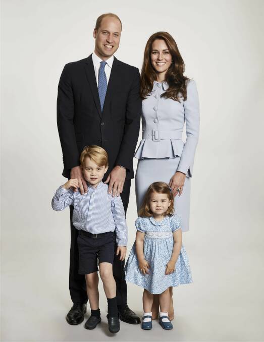 Britain's Prince William, and Kate, the Duchess of Cambridge, pose with their children Prince George and Princess Charlotte, at Kensington Palace. The photo has been used on the Cambridges' Christmas card. Picture: Chris Jackson/Kensington Palace via AP