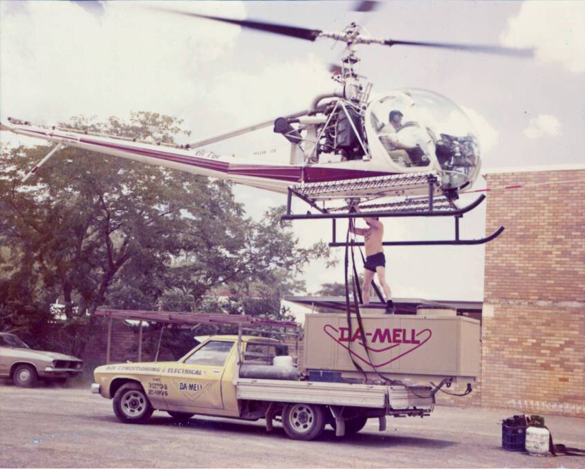 CHOPPER POWER: John Mellors used a helicopter to put large commercial air conditioning units in their place back in the 1970s.