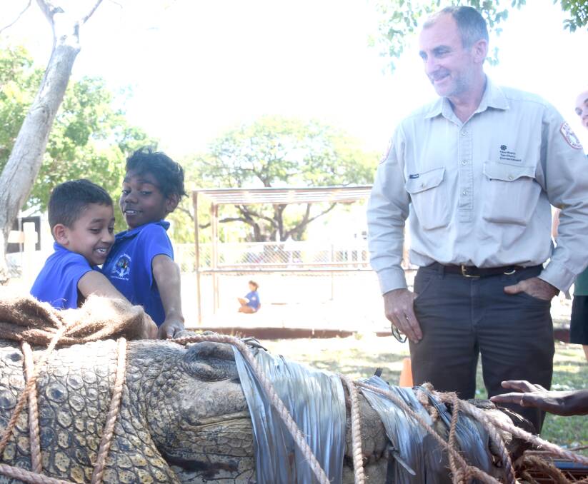 SHOW AND TELL: Declan Lurda and Frankie Lewis were brave enough to pat a big saltwater crocodile today. 