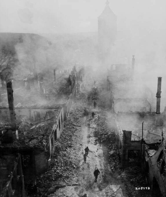Destruction: Soliders in Waldenburg, Germany in April 1945 after an Allied raid. Picture: Lt Jacob Harris 