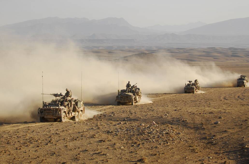 On Patrol: Australian special forces on patrol in a convoy in Afghanistan in 2009. Picture: NATO 