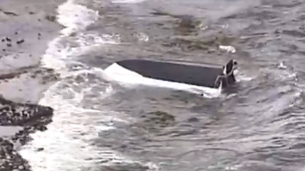 A shot of the capsized boat at Kurnell. Picture: 7 News