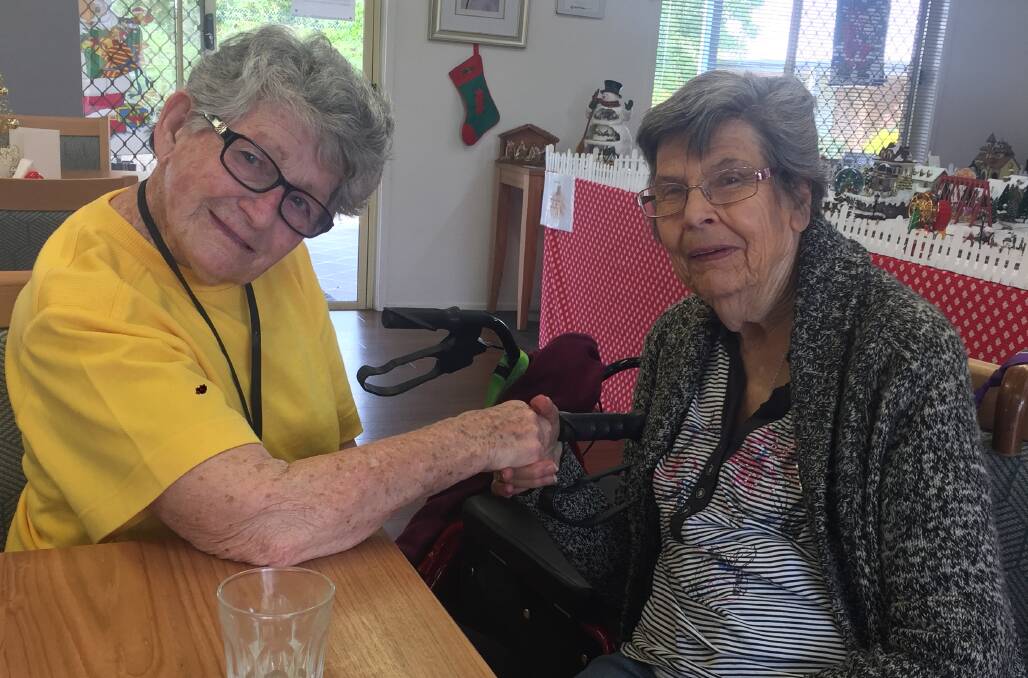 REUNITED: Valda Dawson (left) with cousin, and neighbour, Dorothy Wallis. 