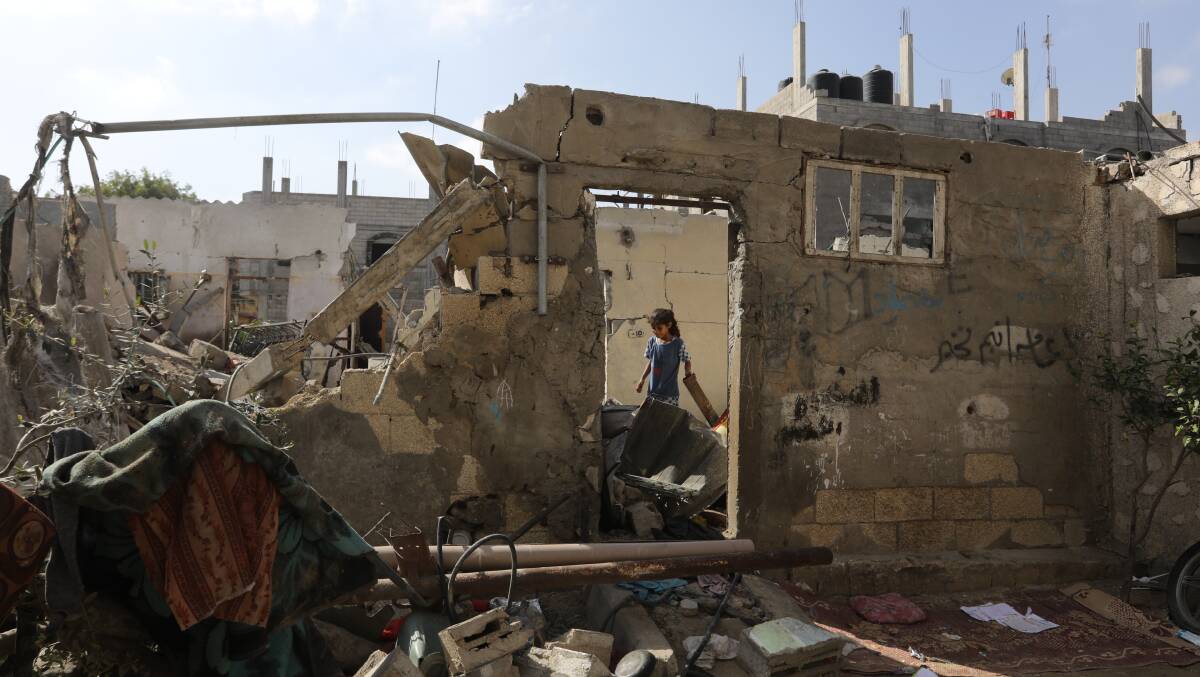 Palestinians inspect their house, after it was destroyed by an Israeli air strike on the city of Rafah in the southern Gaza Strip, on November 10. Picture Shutterstock
