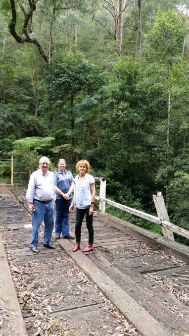 Dilapidated: Cr Kevin Schreiber, Beth Raines from Mt Wilson-Mt Irvine RFB and Cr Kerry Brown on the bridge over Bowens Creek.