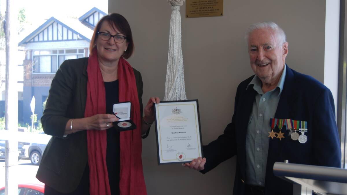 Macquarie MP, Susan Templeman, presents WWII veteran Geoffrey Medcalf with his commemorative medal and certificate marking the 75th anniversary of the end of the war in the Pacific.
