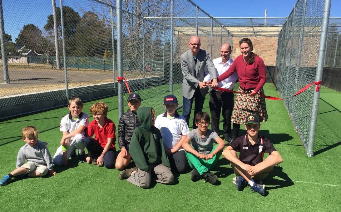 Season opener: Mayor Mark Greenhill and Blue Mountains MP Trish Doyle cut the ribbon with club president Danny Brown and some of the club's junior players.