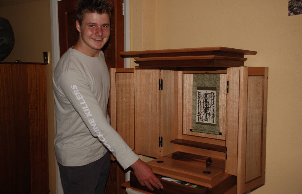 Exemplary: Ben Weller with his butsudan, a Japanese Buddhist shrine.
