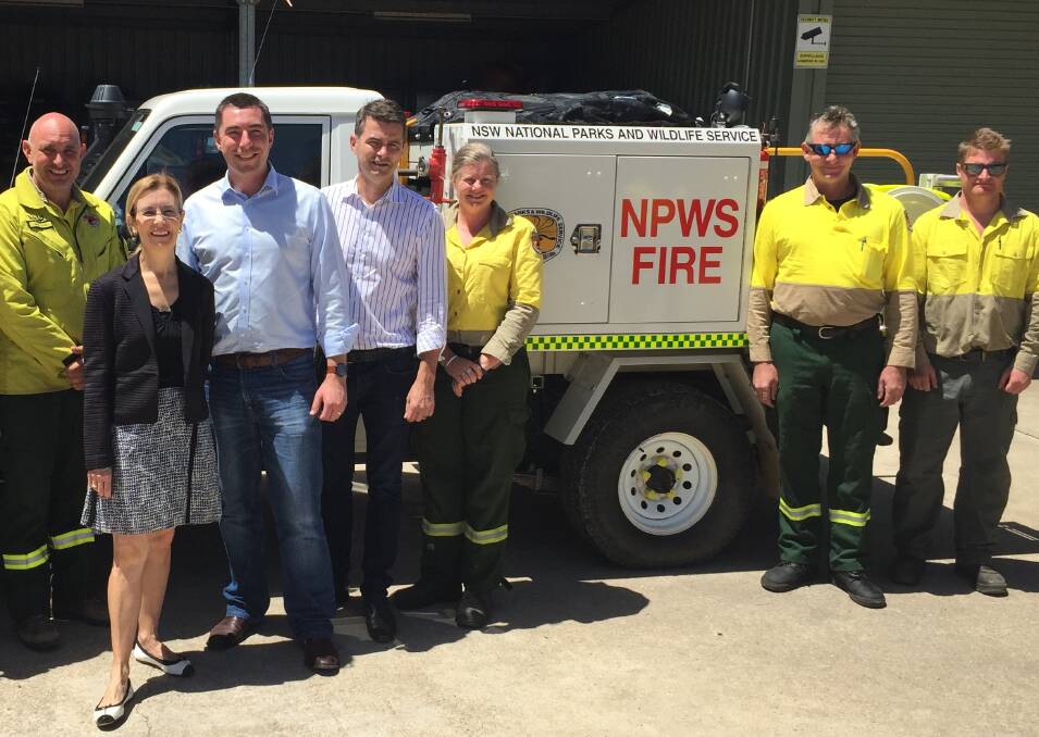 Truck upgrade: Environment minister Gabrielle Upton, Liberal candidate for Blue Mountains Owen Laffin and Upper House MP Shayne Mallard with members of the NPWS at Blackheath with a new Category 9 fire truck.