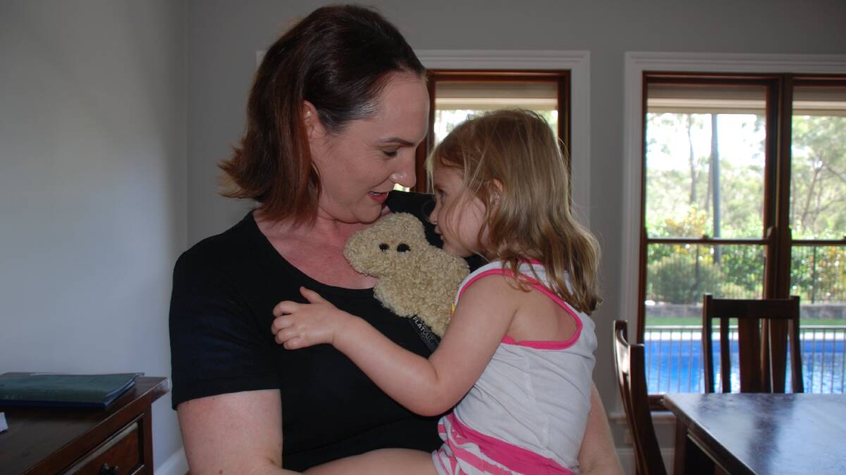 Not what you expect to hear: Michelle Kitcheman, with daughter Lyla at their Springwood home, was diagnosed with melanoma at age 34.