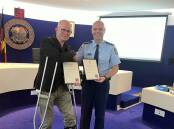 Acting Inspector Rob Capewell presents certificates of appreciation to the mayor, Cr Mark Greenhill. Picture Jennie Curtin 