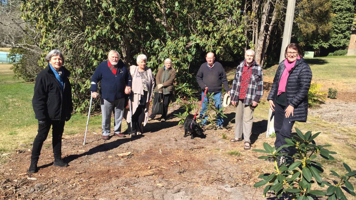Jenny Kelly (Friends of Blackheath Memorial Park and Pool), Graeme and Sandra Bolitho (RSL), Linda McLaughlin, Rob Emanuel (with Jimmy the dog) and Paul Vale (Friends) with Macquarie MP, Susan Templeman with some of the new rhododendrons in the Blackheath park.
