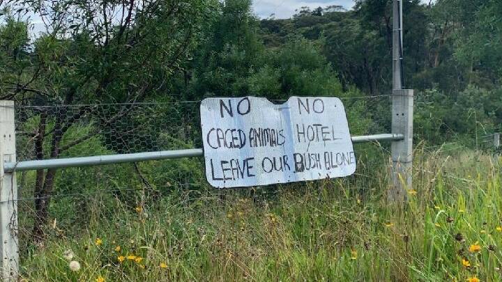 Not popular: Opposition to the croc park made plain in a sign on the fence.