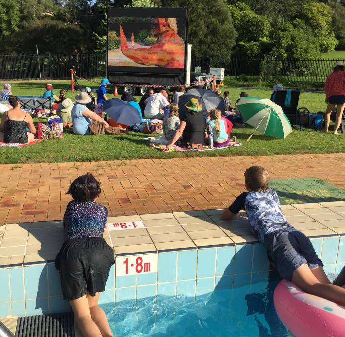 Keeping cool: Now, that's how to watch a movie on a hot night. These two swimmers didn't even have to leave the pool at Blackheath to enjoy Moana last Friday.
