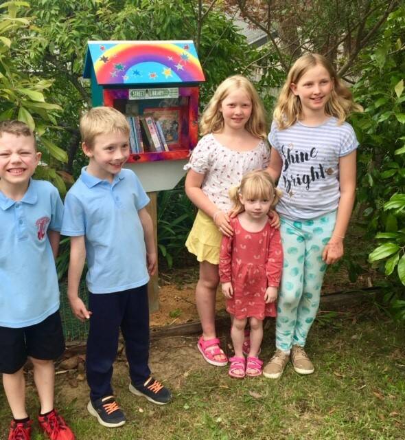 Cameron, Raiden and Tylah celebrate the new Kids Street Library at Wentworth Falls with sisters Neva and Peri.