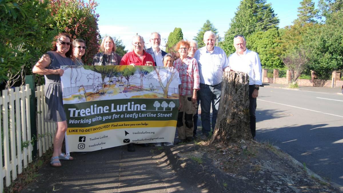 Supporters: Some of the crew who hope to receive a grant to begin the Treeline Lurline project along the main route to Echo Point in Katoomba. Artwork on the banner is by David Wardman.