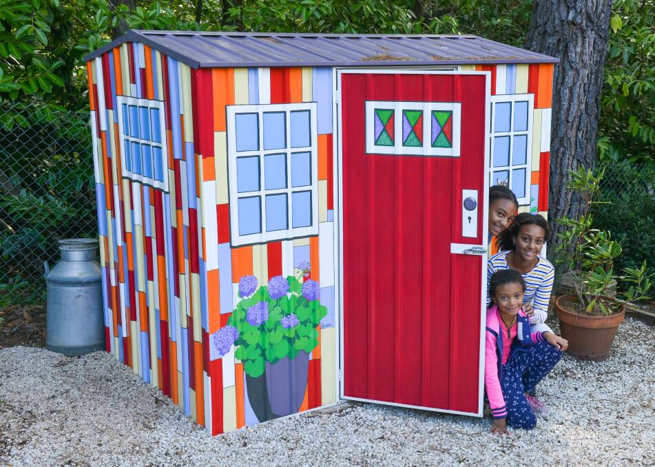 That's some shed: LIndena Robb's handiwork, as admired by her granddaughters Sarai, Ayla and Nixie. Brigitte Grant photo