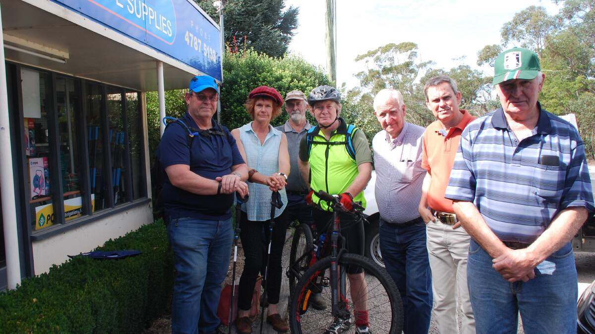 No path: Tony Jacques, Cr Kerry Brown, Bob Small, Hereward Dundas-Taylor,  Cr Kevin Schreiber, Michael Paag and Dick Harris outside Weber's nursery, where parking would be affected by the proposed bike path.