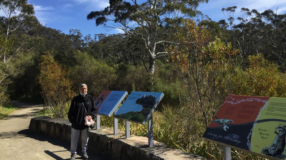 Coming home: Aunty Carol Cooper beside one of the interpretive displays in The Gully.