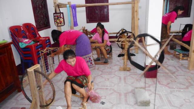 Women's business: Laotian women learning to weave at the School of Arts.